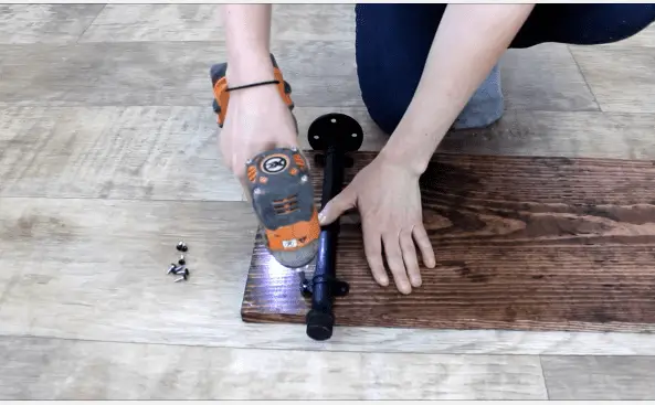Step 4b fixing pipe on wooden board