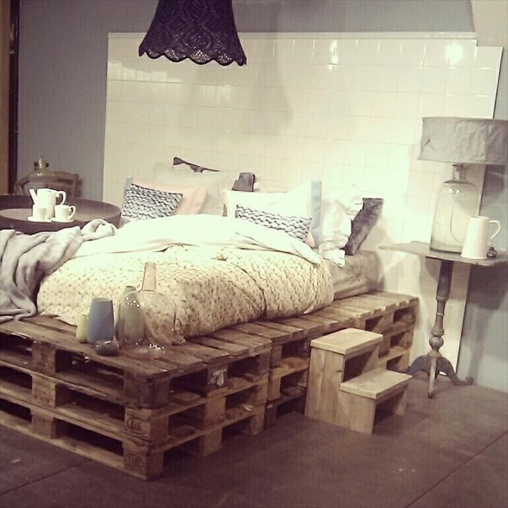 Layered Pallet Frame Bed With White Tile Background