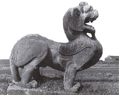 A Sculpture Of A Lion With Wings
